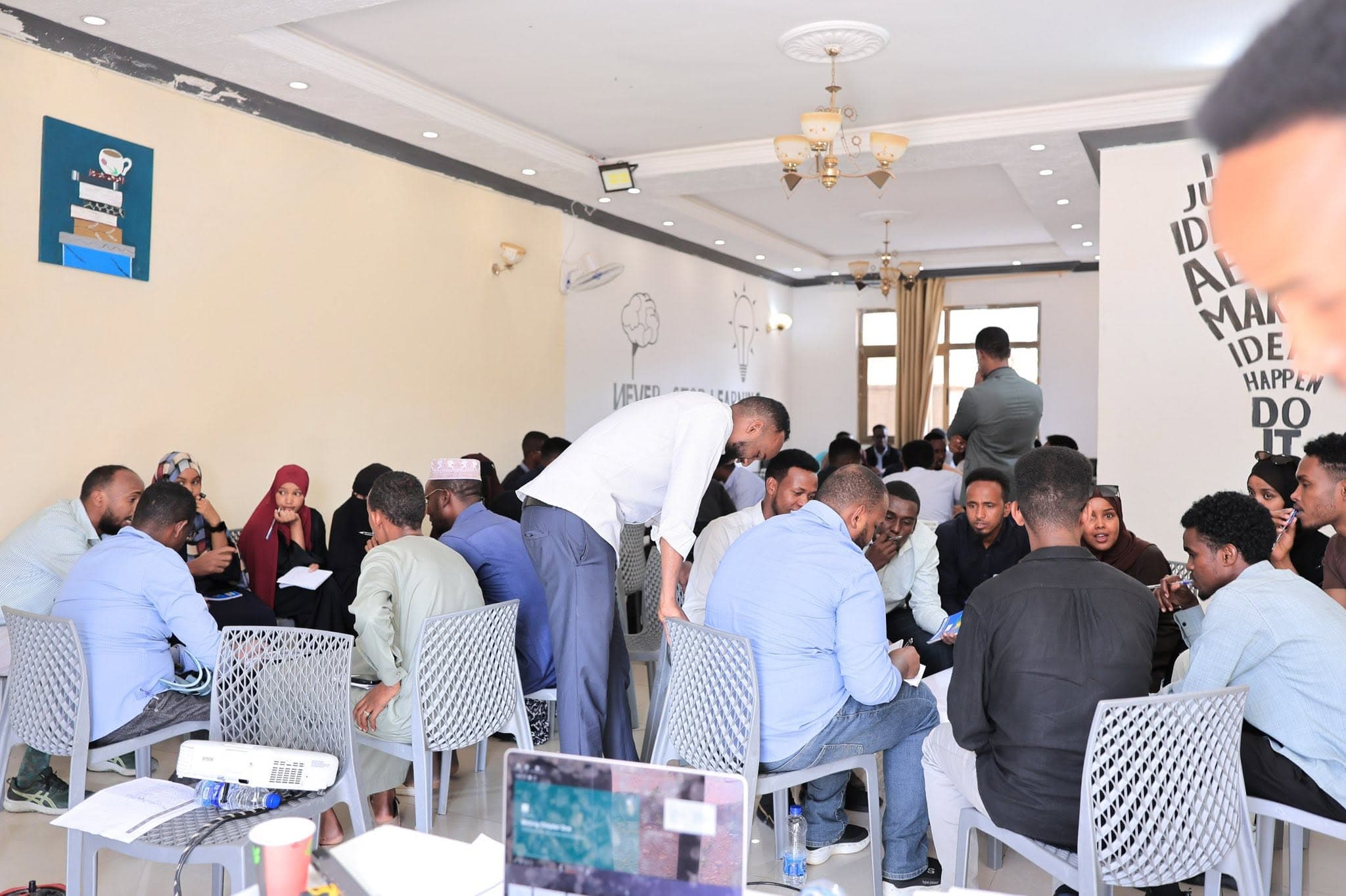 Participants working in small groups at a Hiraad Institute workshop